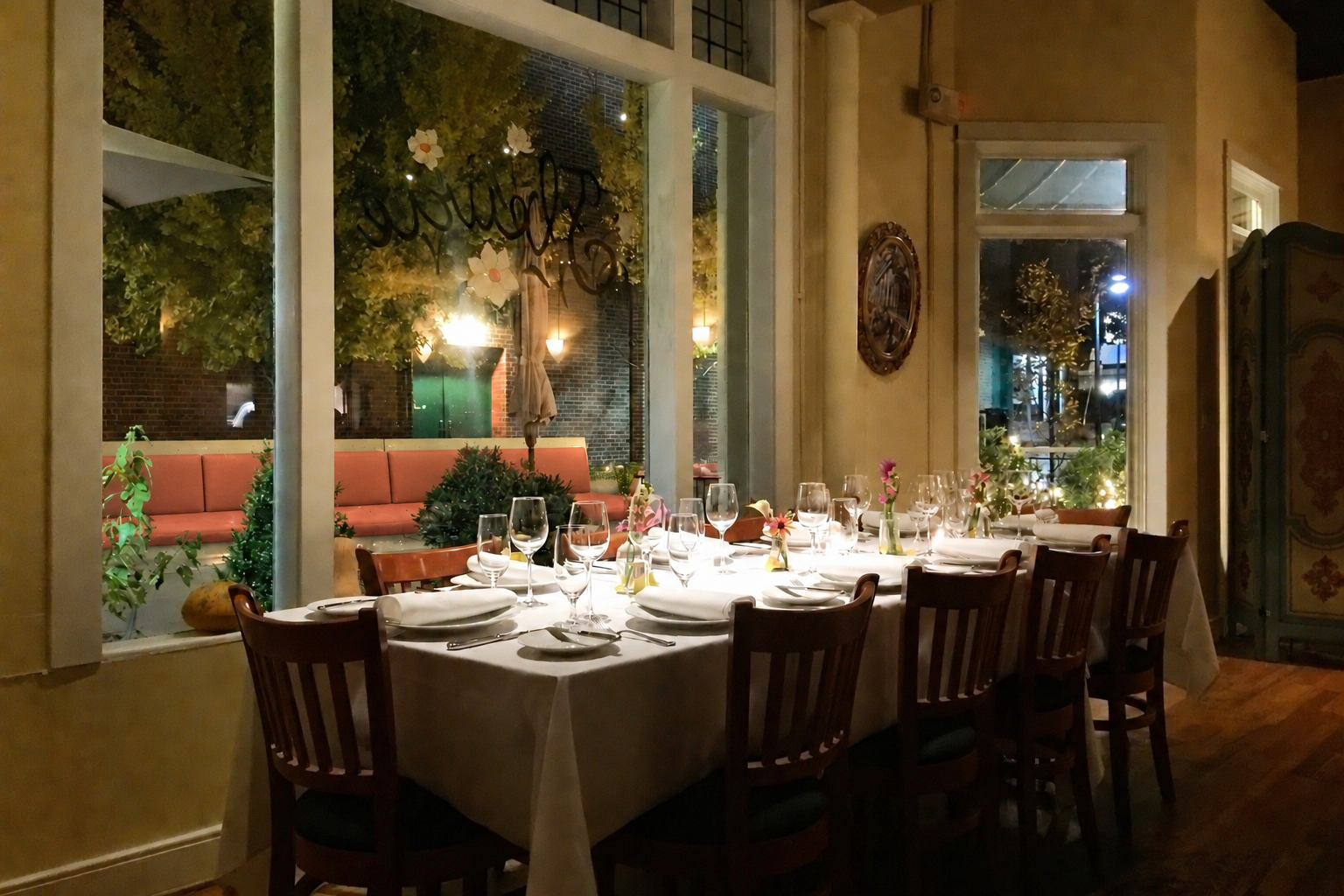 Fleurie’s dining room, with its floral logo in the window and tables set for the evening