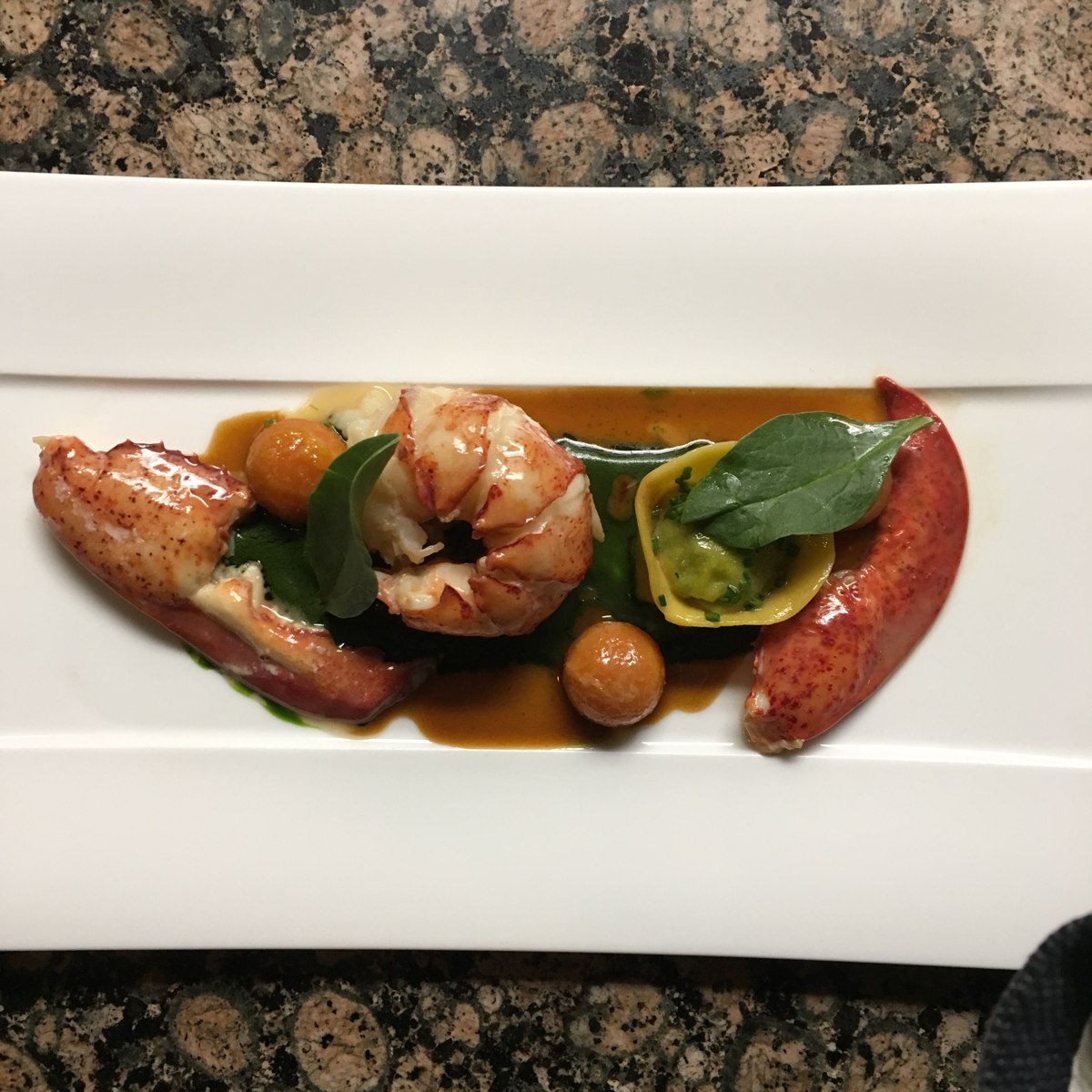 Butter-poached lobster with spinach mousseline and raviolo at Fleurie