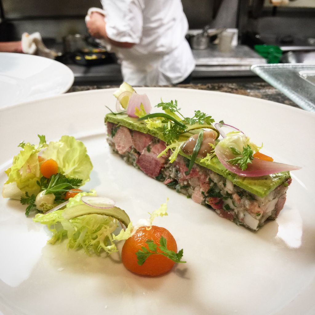 Ham hock terrine with gribiche and fresh greens, photographed at Fleurie’s kitchen pass